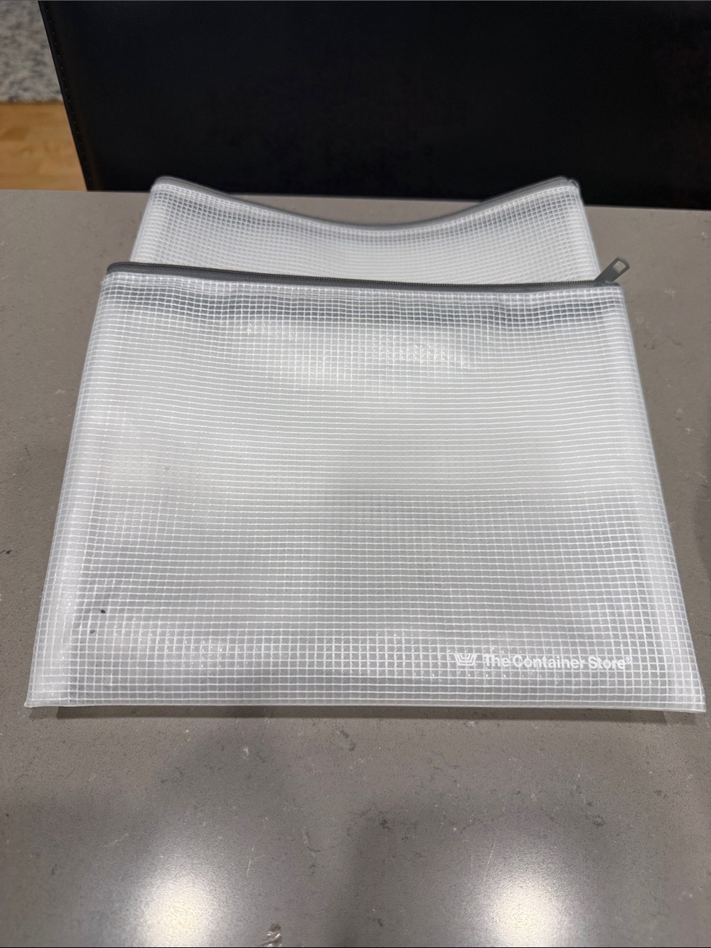 The Container Store Mesh Pouches with Zipper.  Approx 7.5” L & 9.5” W
